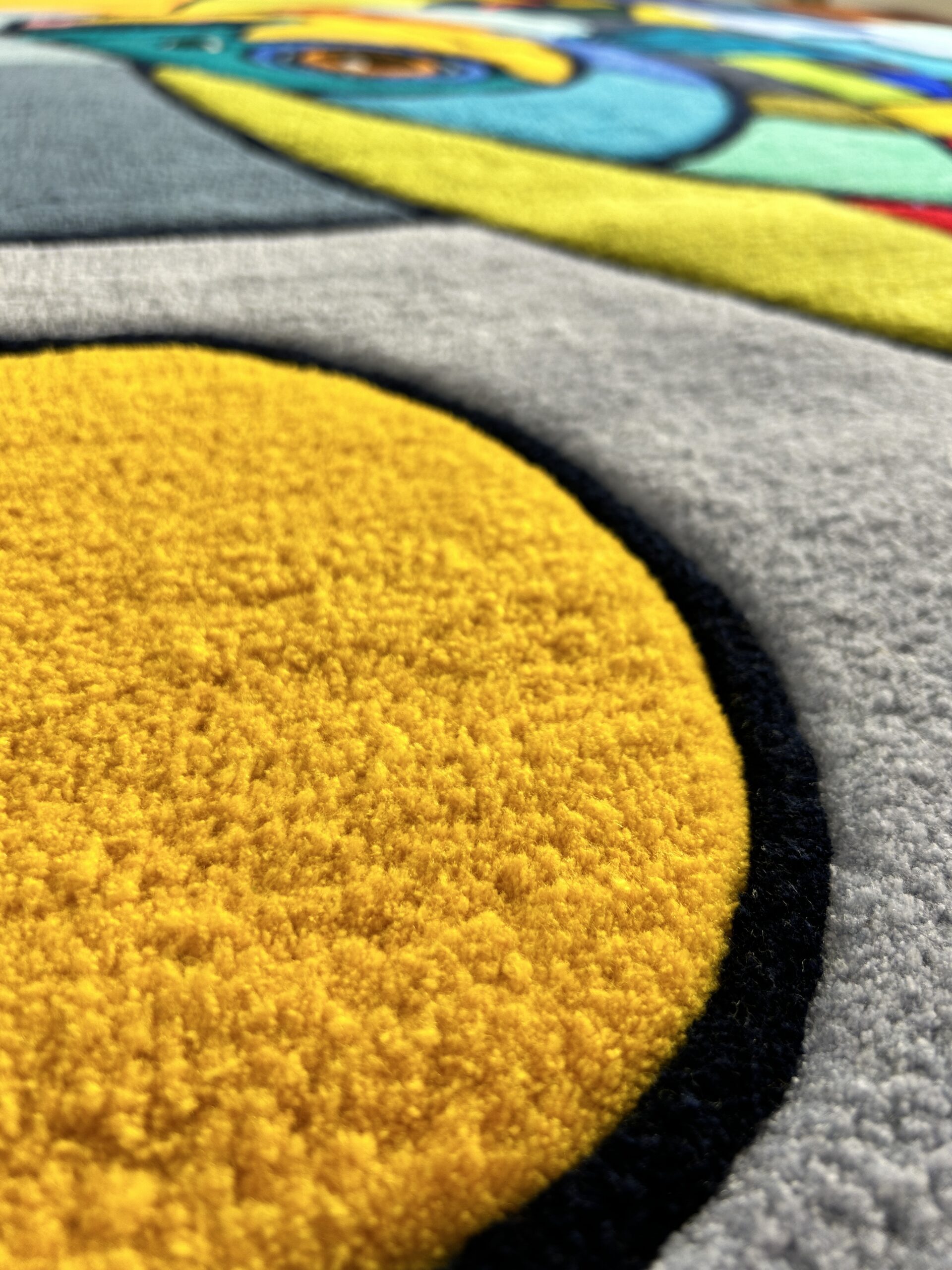 Handmade tufted fish rug close up view